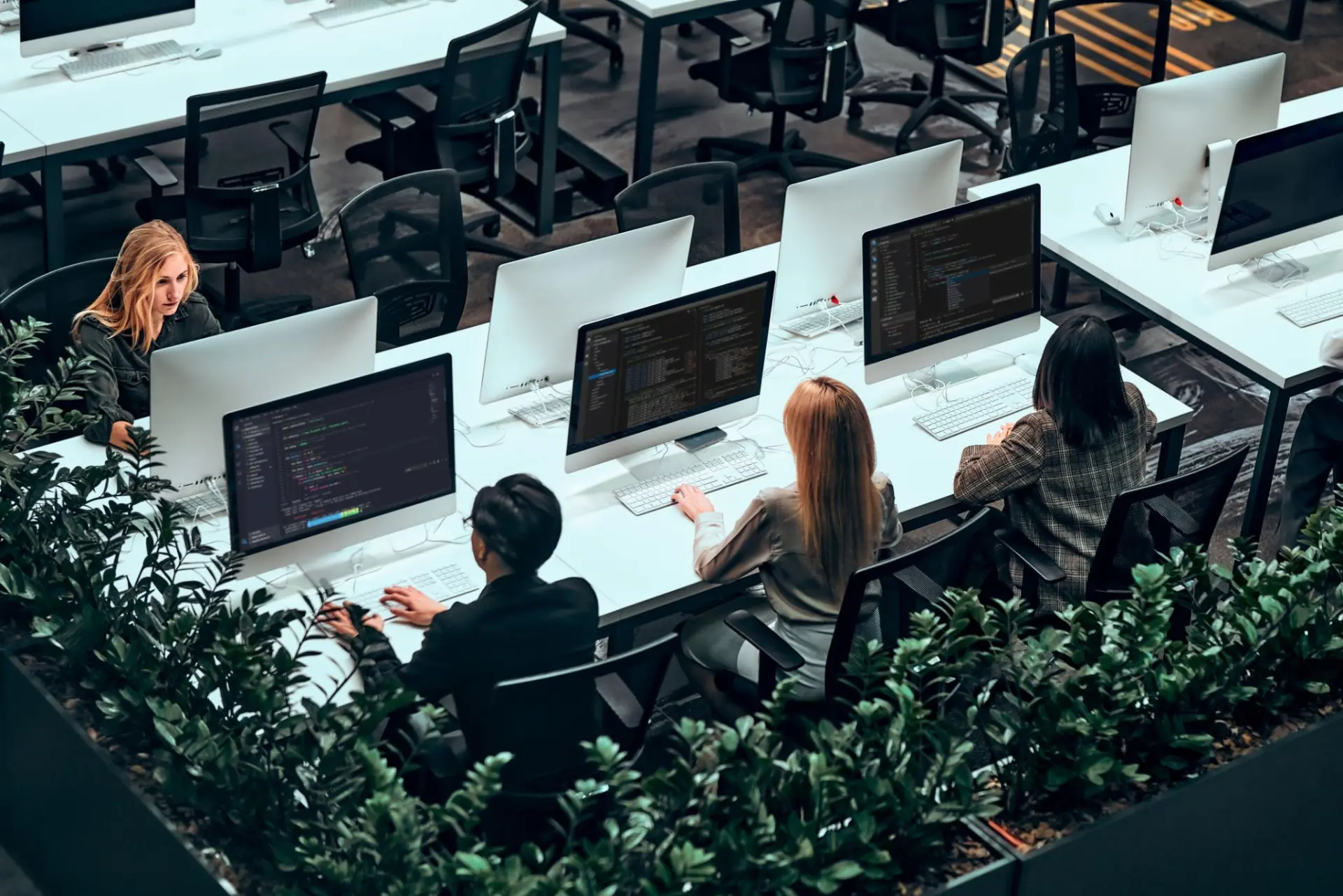 Engineering team working at desks in a modern technology office