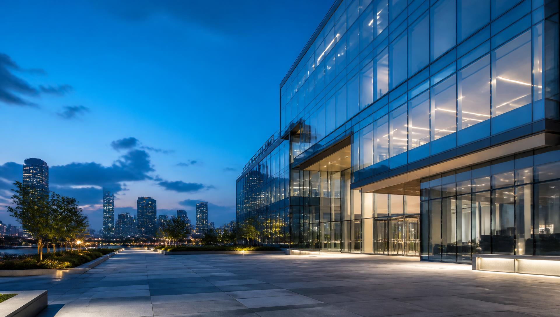 Modern glass enterprise technology campus at blue hour